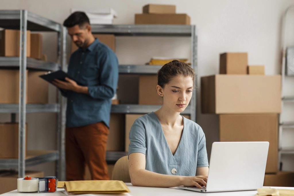 woman working on laptop in corporate setting